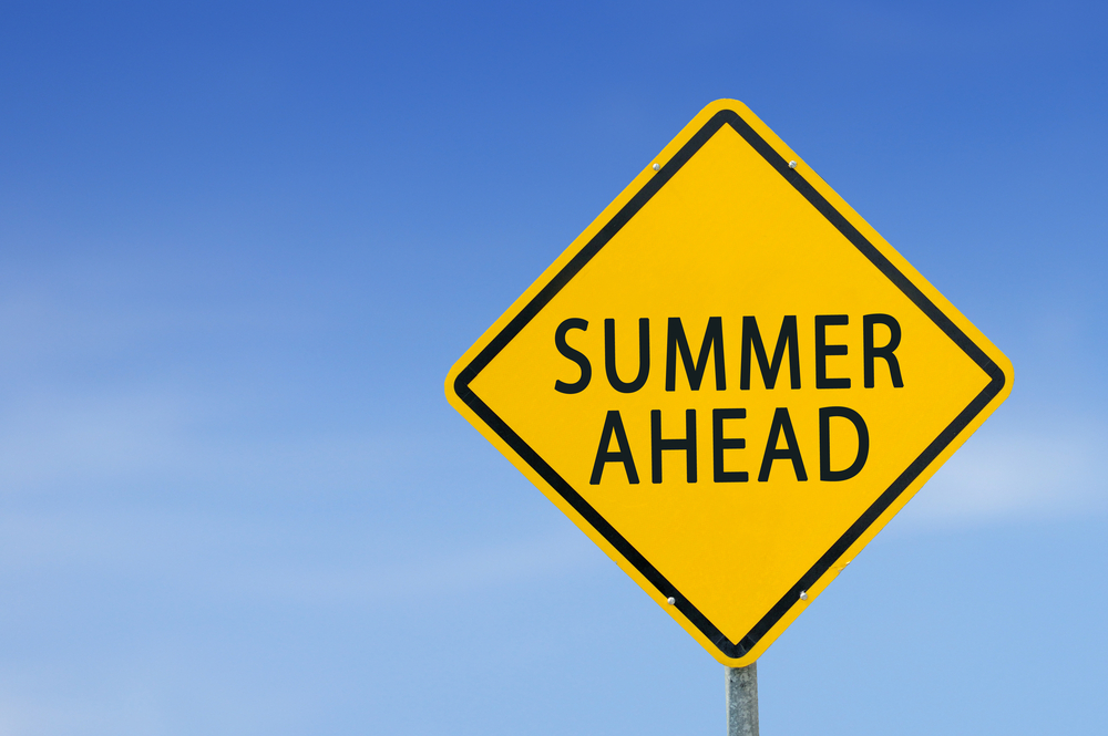 Yellow,Traffic,Sign,”summer,Ahead”,On,The,Sky,Background