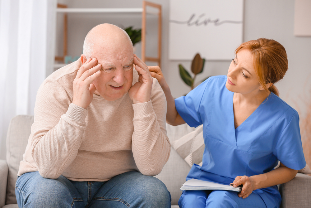 Elderly,Man,Suffering,From,Mental,Disability,And,Caregiver,In,Nursing