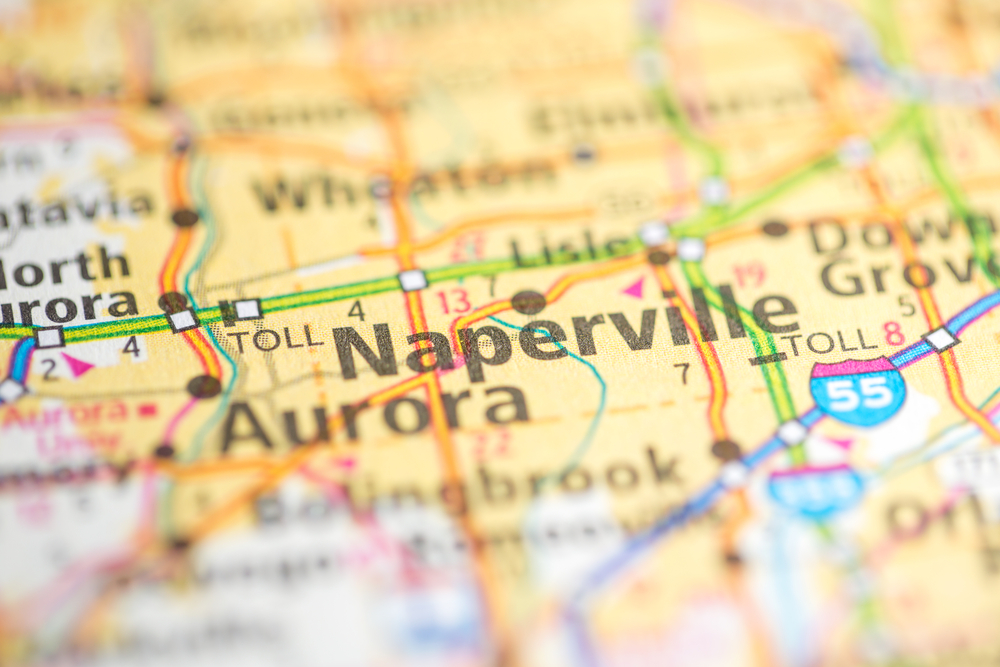 Close-up of a map highlighting Naperville and surrounding cities including Aurora and Wheaton in Illinois
